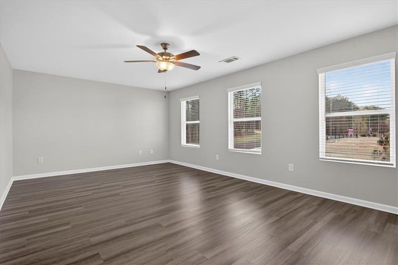136 Brexley Drive Calhoun, GA 30701 - Photo 29 of 48 a view of an empty room with wooden floor and a window