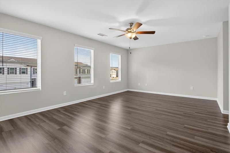 136 Brexley Drive Calhoun, GA 30701 - Photo 31 of 48 a view of an empty room with wooden floor and a window