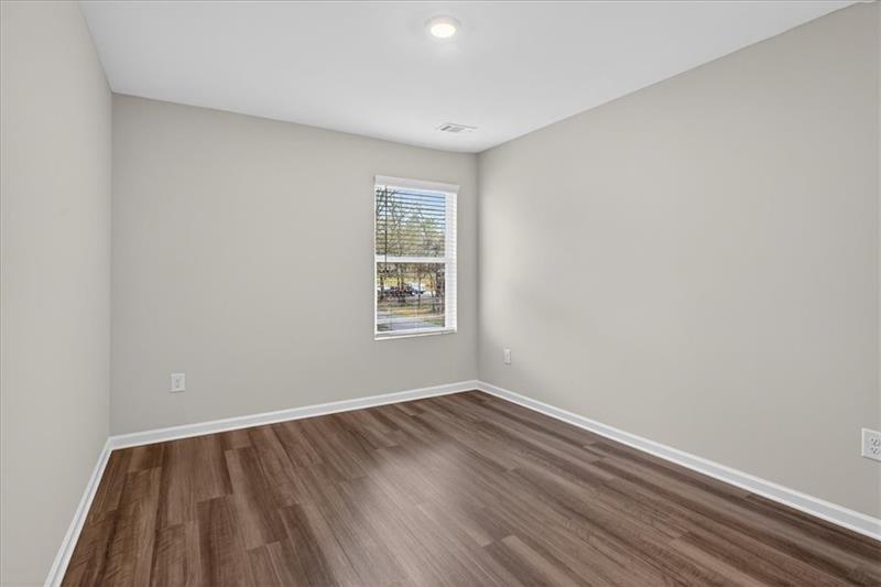 136 Brexley Drive Calhoun, GA 30701 - Photo 36 of 48 wooden floor in an empty room with a window