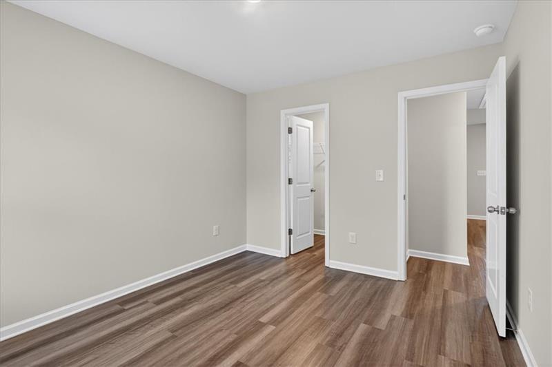136 Brexley Drive Calhoun, GA 30701 - Photo 37 of 48 a view of an empty room with wooden floor