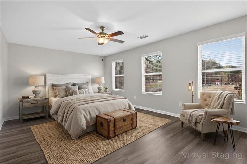 136 Brexley Drive Calhoun, GA 30701 - Photo 4 of 48 a bedroom with a bed and wooden floor