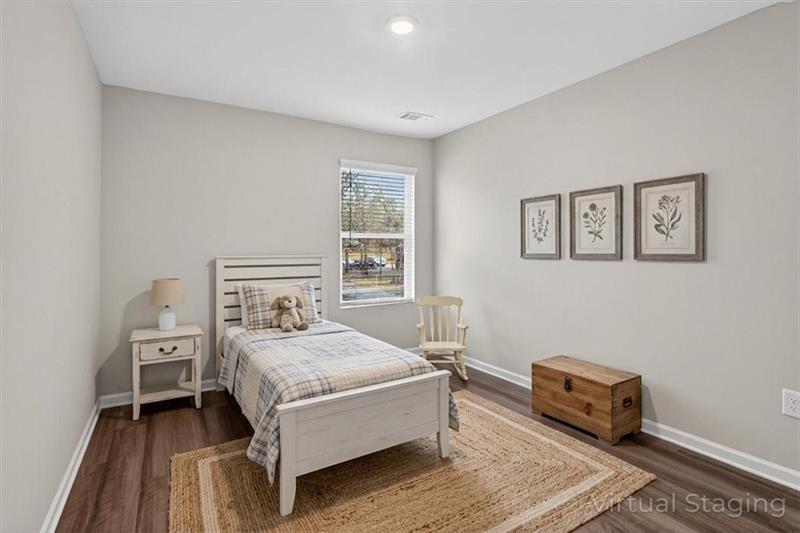 136 Brexley Drive Calhoun, GA 30701 - Photo 5 of 48 a bedroom with a bed and a couch