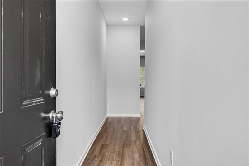 136 Brexley Drive Calhoun, GA 30701 - Photo 6 of 48 a view of a hallway with wooden floor