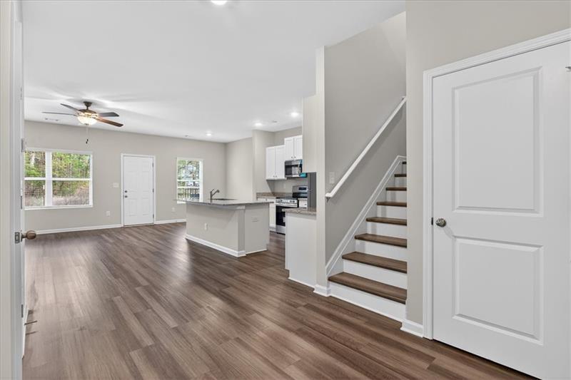 136 Brexley Drive Calhoun, GA 30701 - Photo 7 of 48 a view of a room with wooden floors and stairs