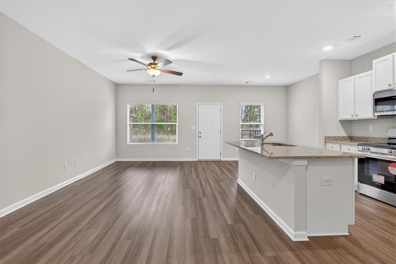 136 Brexley Drive Calhoun, GA 30701 - Photo 8 of 48 a view of kitchen with sink and wooden floor