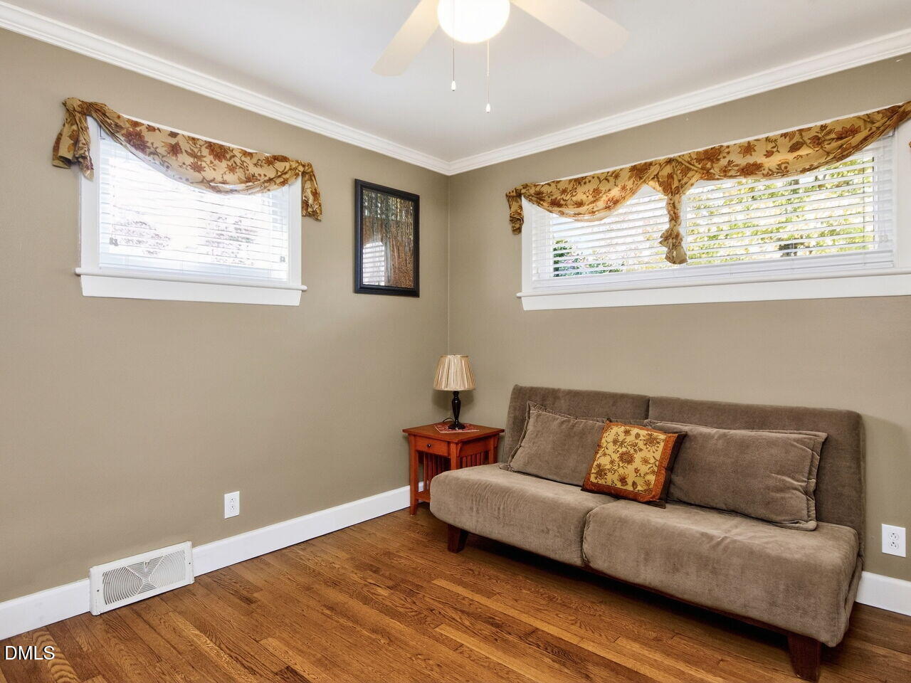 1123 Horseshoe Road Durham, NC 27703 - Photo 14 of 35 a living room with a couch and a large window