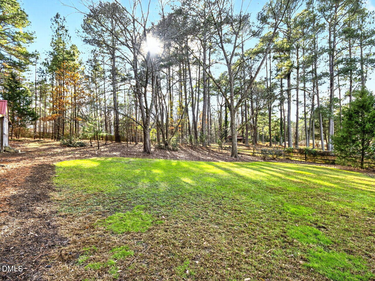 1123 Horseshoe Road Durham, NC 27703 - Photo 20 of 35 a view of swimming pool with outdoor seating and trees