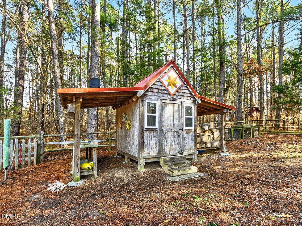 1123 Horseshoe Road Durham, NC 27703 - Photo 21 of 35 a front view of a house with a porch