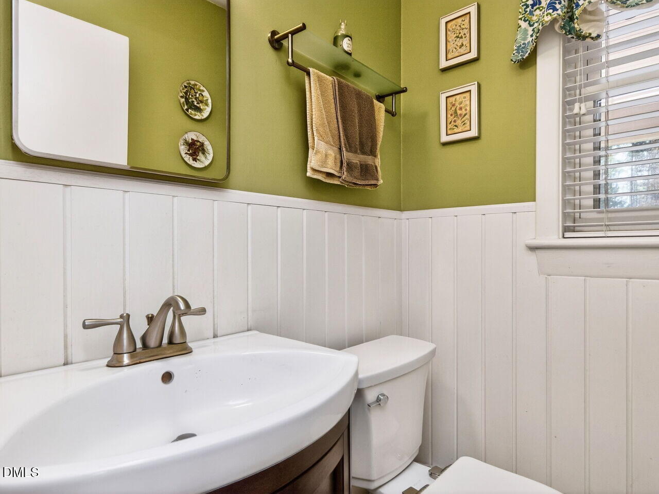 1123 Horseshoe Road Durham, NC 27703 - Photo 27 of 35 a bathroom with a sink and a toilet