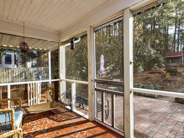 a view of a balcony with wooden floor