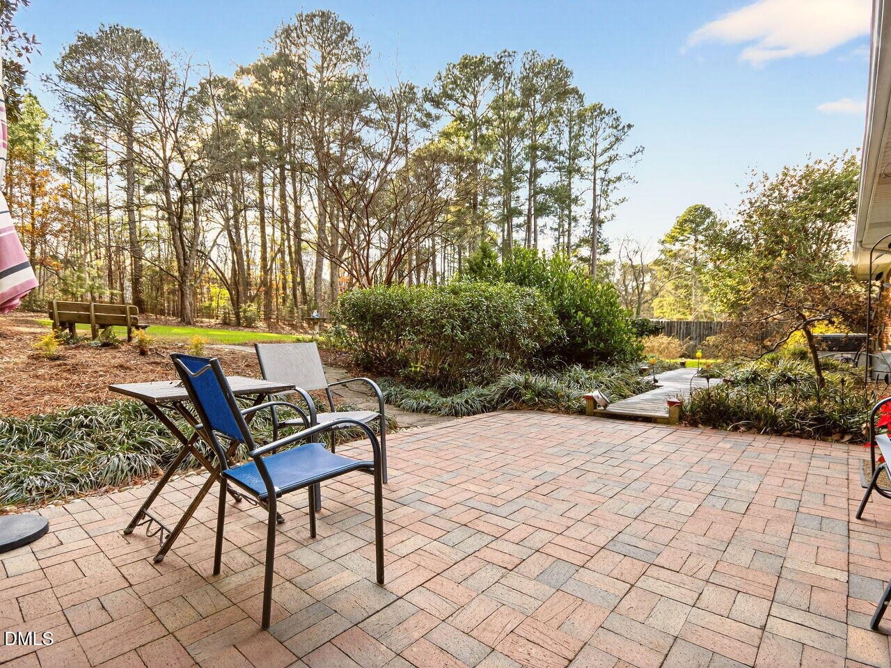 1123 Horseshoe Road Durham, NC 27703 - Photo 30 of 35 a backyard of a house with table and chairs