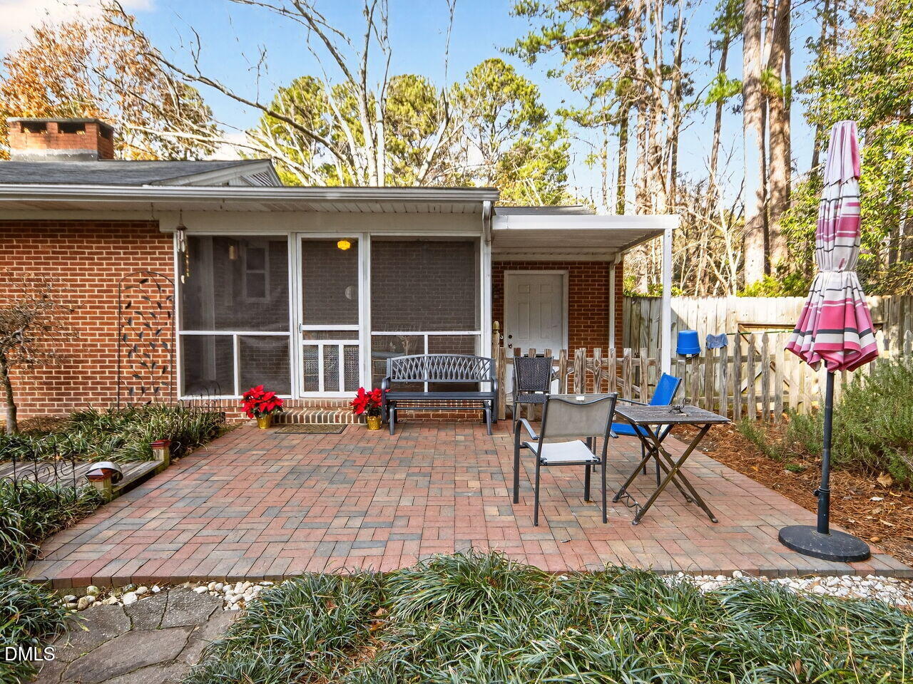 1123 Horseshoe Road Durham, NC 27703 - Photo 31 of 35 a view of a chairs and table in a back yard of the house