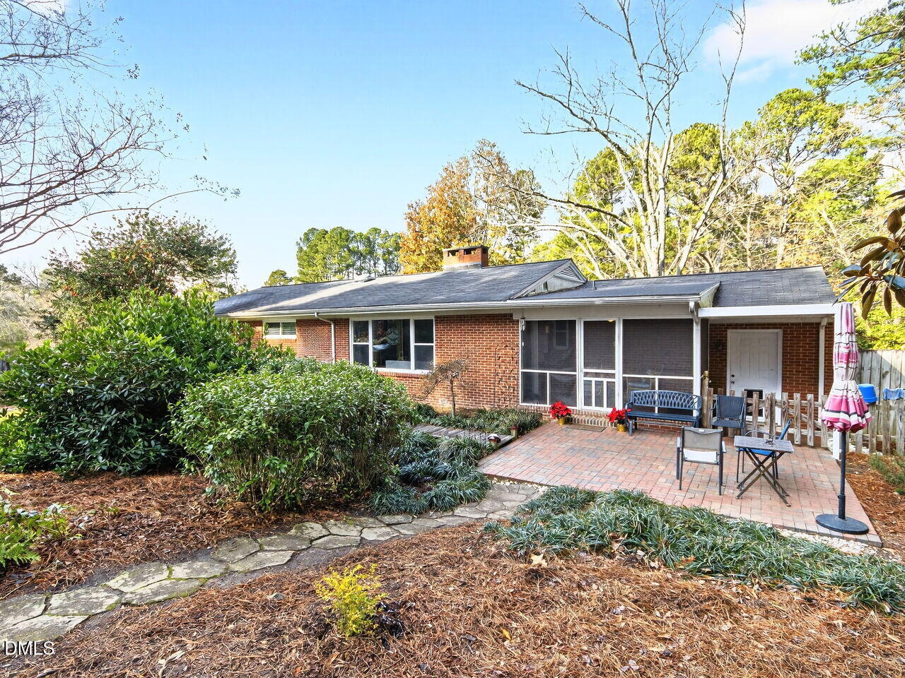 1123 Horseshoe Road Durham, NC 27703 - Photo 33 of 35 a front view of a house with patio