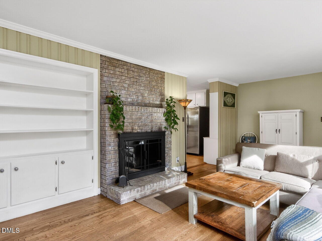 1123 Horseshoe Road Durham, NC 27703 - Photo 3 of 35 a living room with furniture and a fireplace