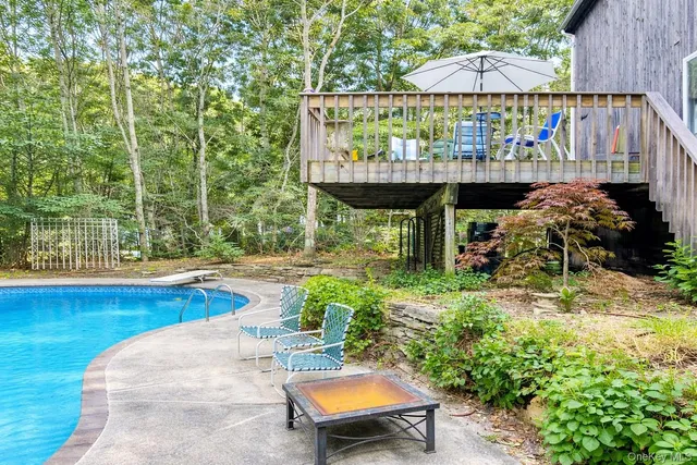 a kitchen with a sink window and cabinets