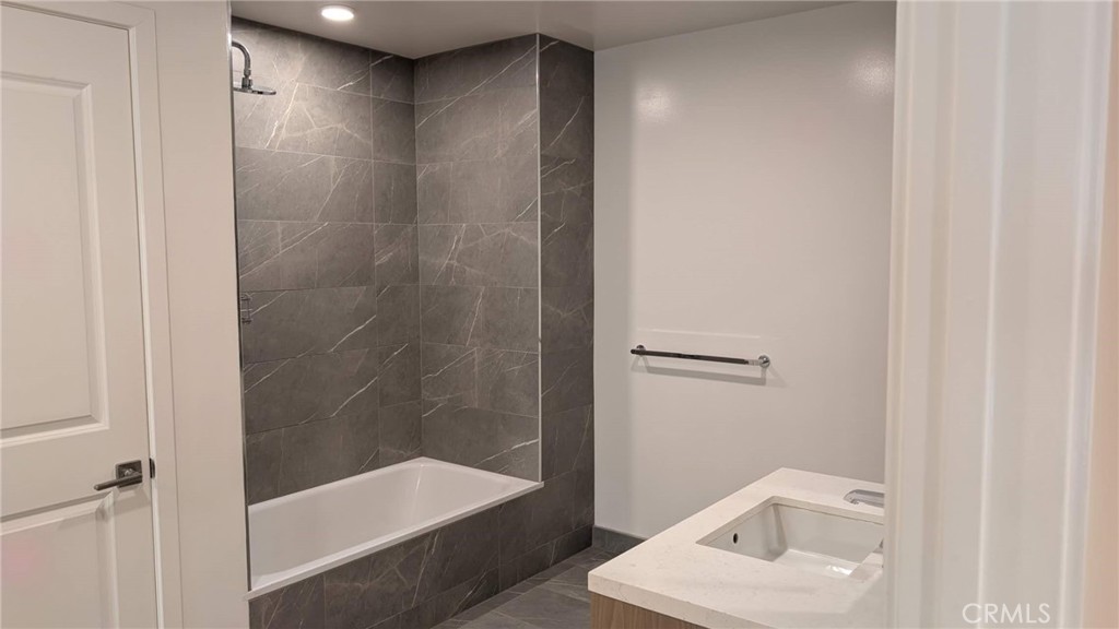 400 South Broadway, Unit 922 Los Angeles, CA 90013 - Photo 11 of 12 a bathroom with a shower and a sink