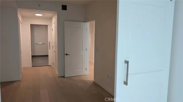 a view of a hallway with a room