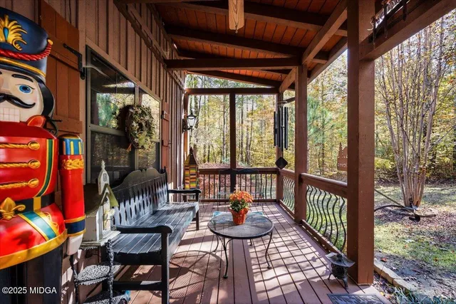 a view of a balcony with furniture