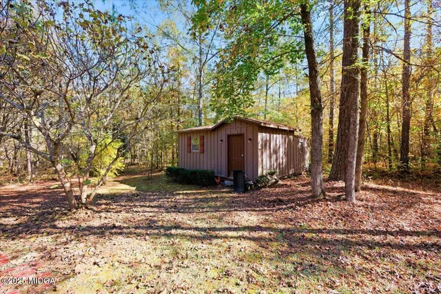 a view of a porch with furniture and wooden floor