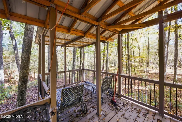 a view of a outdoor space with trees in the background