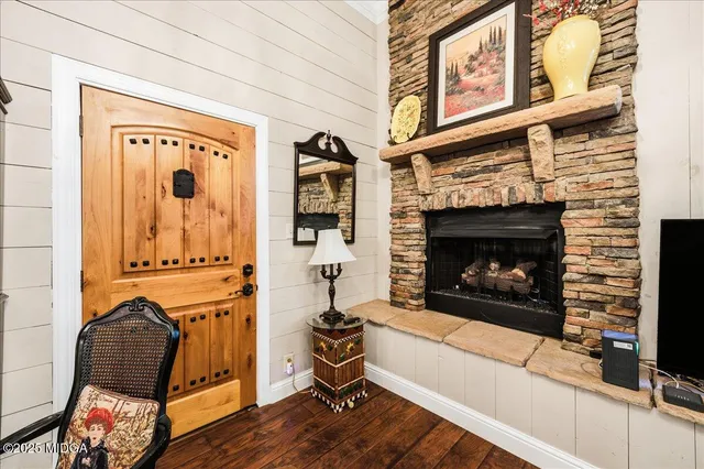 a living room with furniture and a fireplace