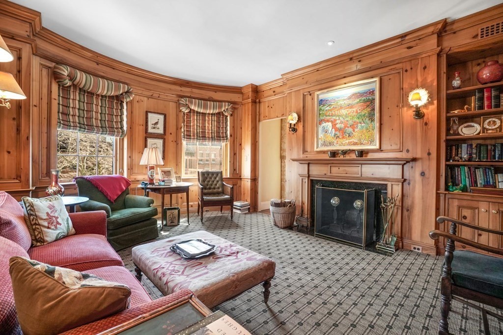 388 Beacon Street, Unit 3 Boston, MA 02116 - Photo 13 of 29 a living room with furniture a fireplace and a large window