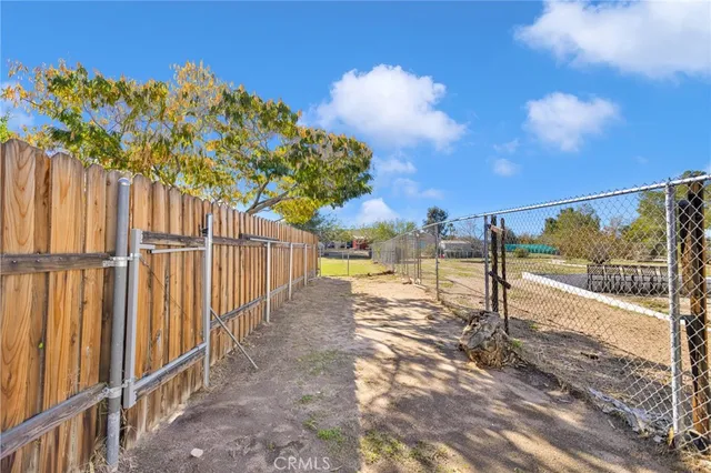 a view of a pathway with a yard