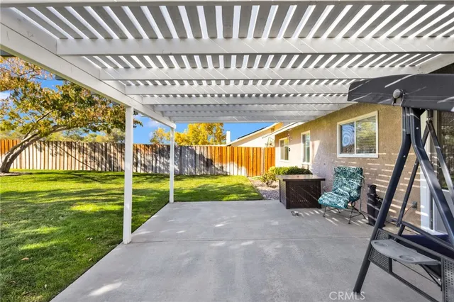 a view of a house with backyard and porch