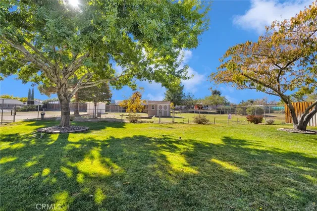 a swimming pool with outdoor seating and yard