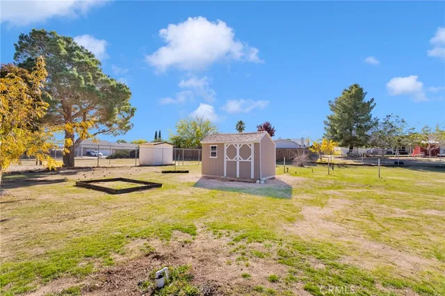 a swimming pool with outdoor seating and yard