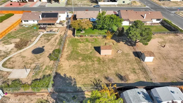 an aerial view of a residential houses with city view