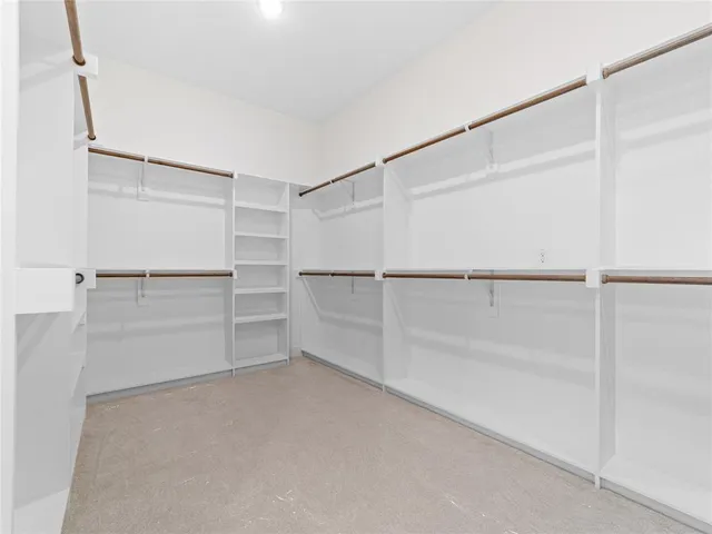 a view of an empty walk in closet