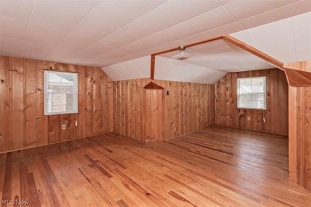 1672 Oakmount Road South Euclid, OH 44121 - Photo 17 of 30 Huge second floor Bedroom which was great space for two growing boys over the years! This could easily be converted to a fabulous Master Suite or great office space! The pine paneling is in perfect condition; however,if one wanted to paint it, that too, would look great !The Hardwood flooring is in great shape...