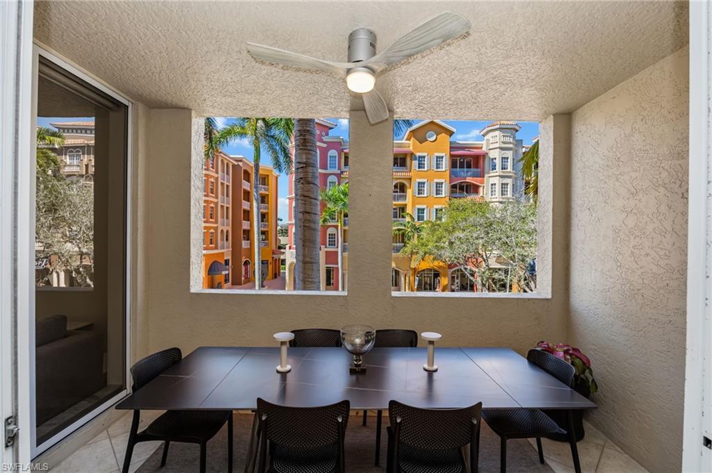 401 Bayfront Place, Unit 3208 Naples, FL 34102 - Photo 14 of 26 a view of a dining room with furniture a chandelier and wooden floor