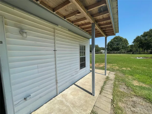 a view of backyard with green space