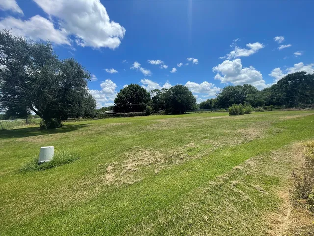 a view of a golf course with a lake