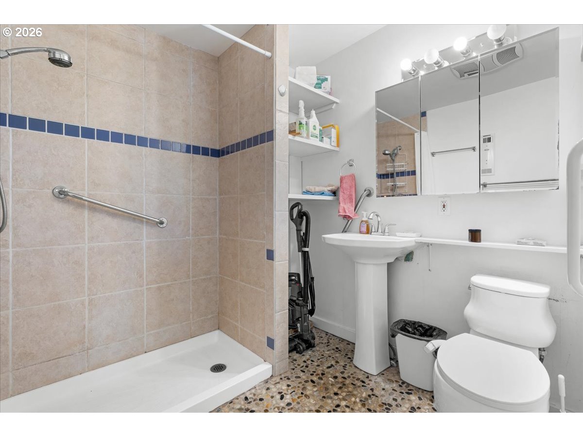 772 Division Street Oregon City, OR 97045 - Photo 12 of 47 a bathroom with a sink toilet and shower