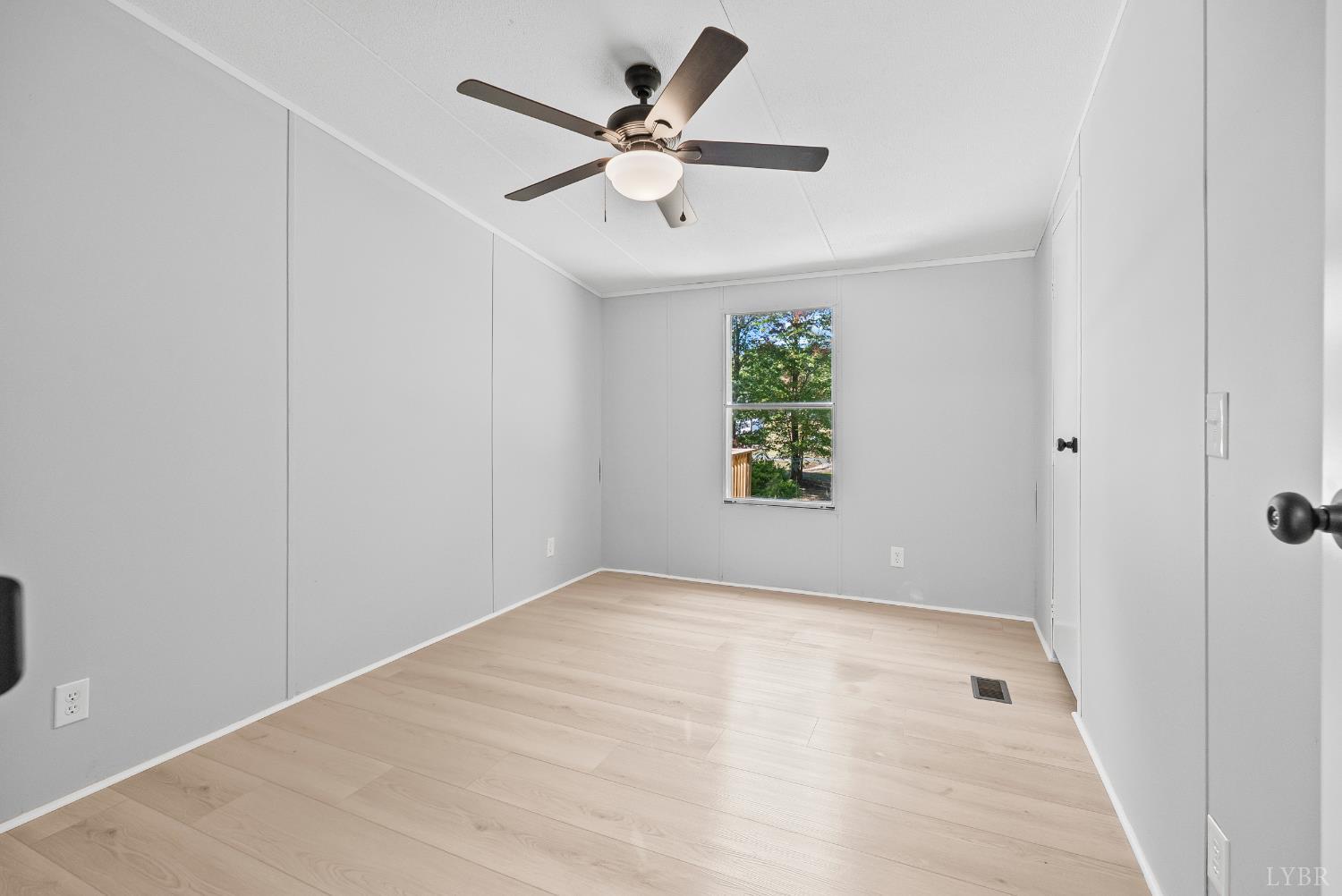 509 Oak Hill Road Prospect, VA 23960 - Photo 19 of 41 wooden floor in an empty room with a window