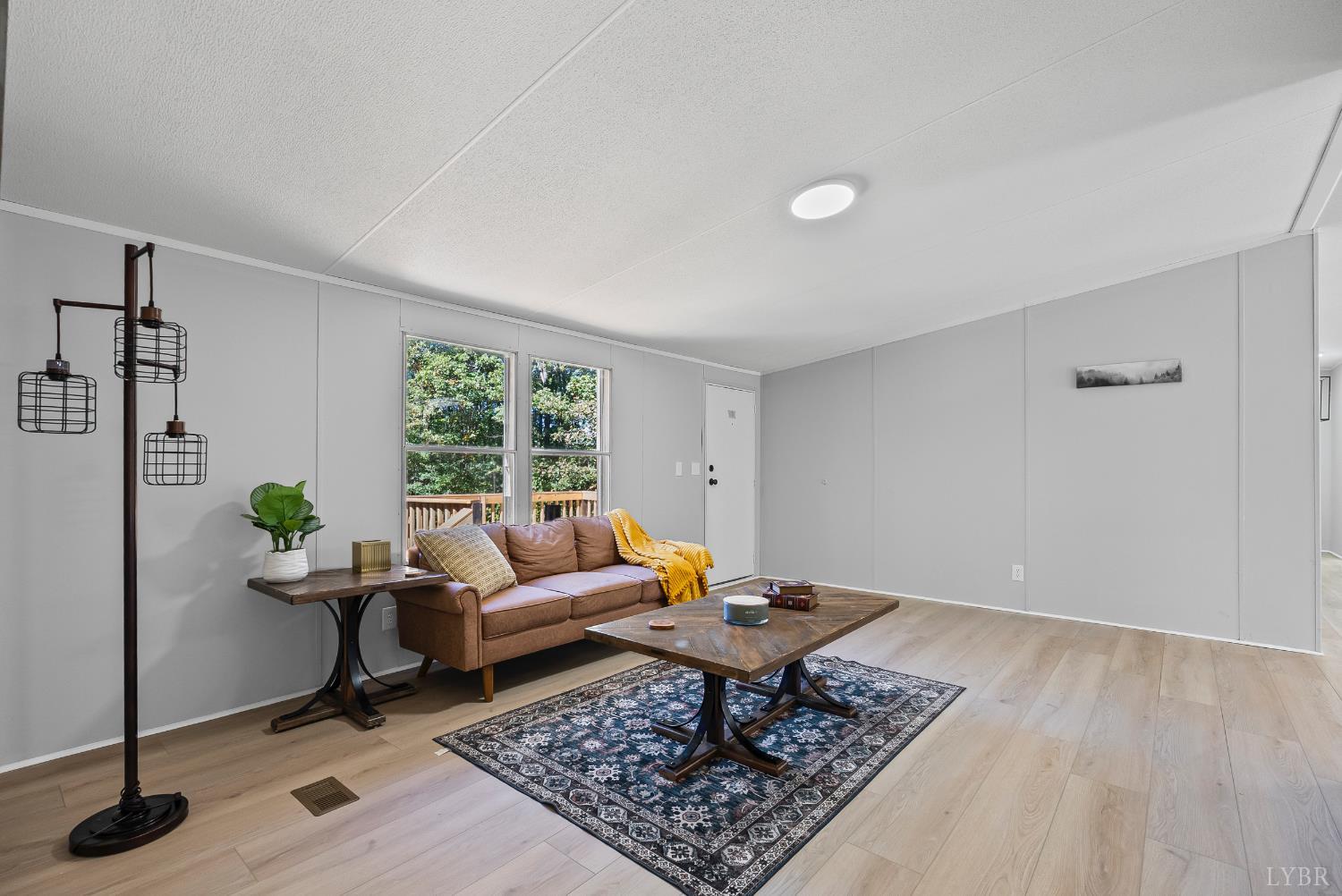 509 Oak Hill Road Prospect, VA 23960 - Photo 2 of 41 a living room with furniture rug and window
