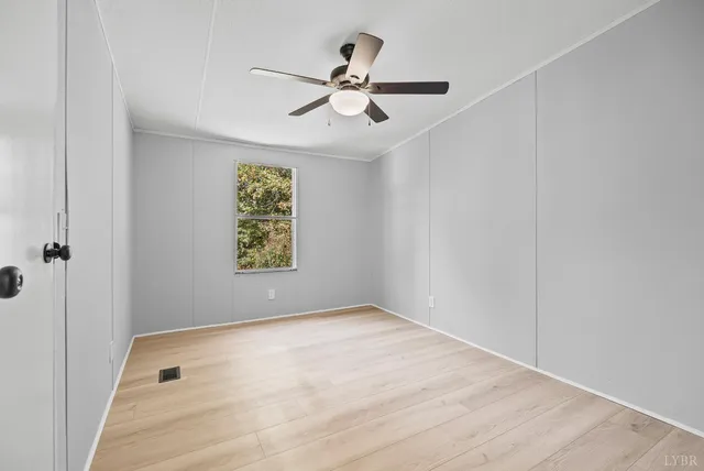 a view of room with window and ceiling fan
