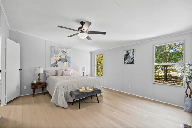 a bed room with a bed and a window