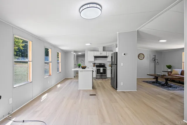 a view of kitchen with furniture and wooden floor