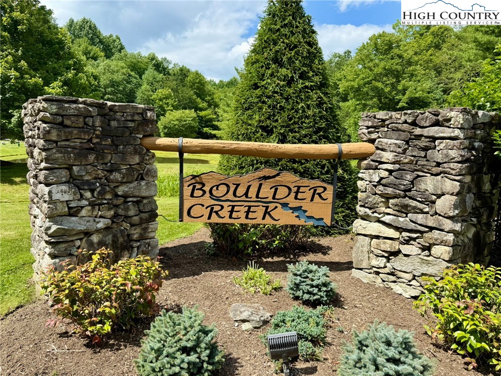 Lot 39 Mossy Creek Boone, NC 28607 - Photo 4 of 50 a sign that is sitting in front of flowers