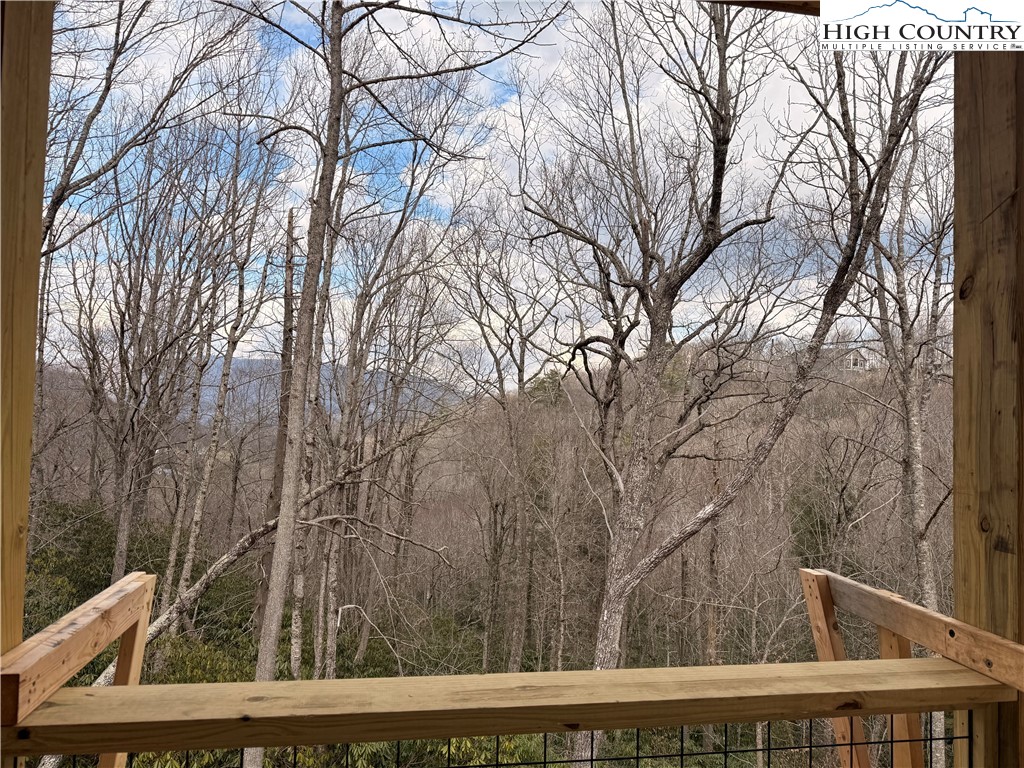 Lot 39 Mossy Creek Boone, NC 28607 - Photo 41 of 50 a view of backyard with wooden fence and large trees