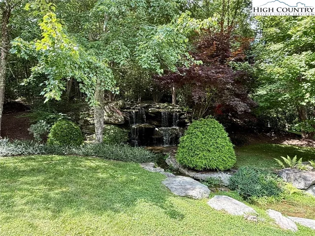 a backyard of a house with a garden and deck