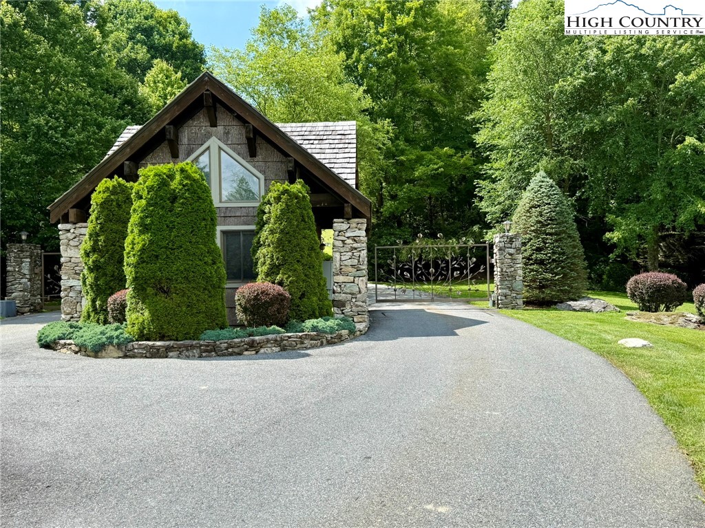 Lot 39 Mossy Creek Boone, NC 28607 - Photo 6 of 50 a front view of a house with a yard