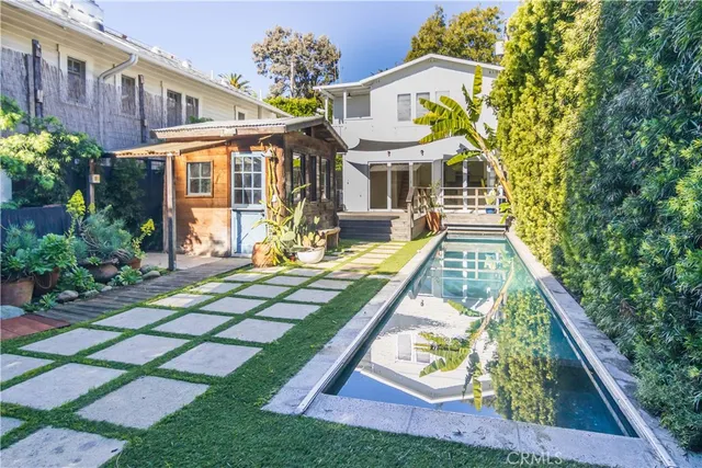 a view of swimming pool with sitting area