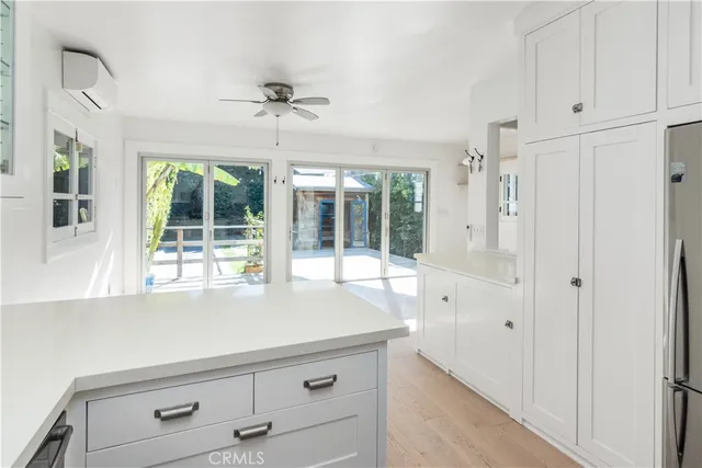 a living room with furniture and large window