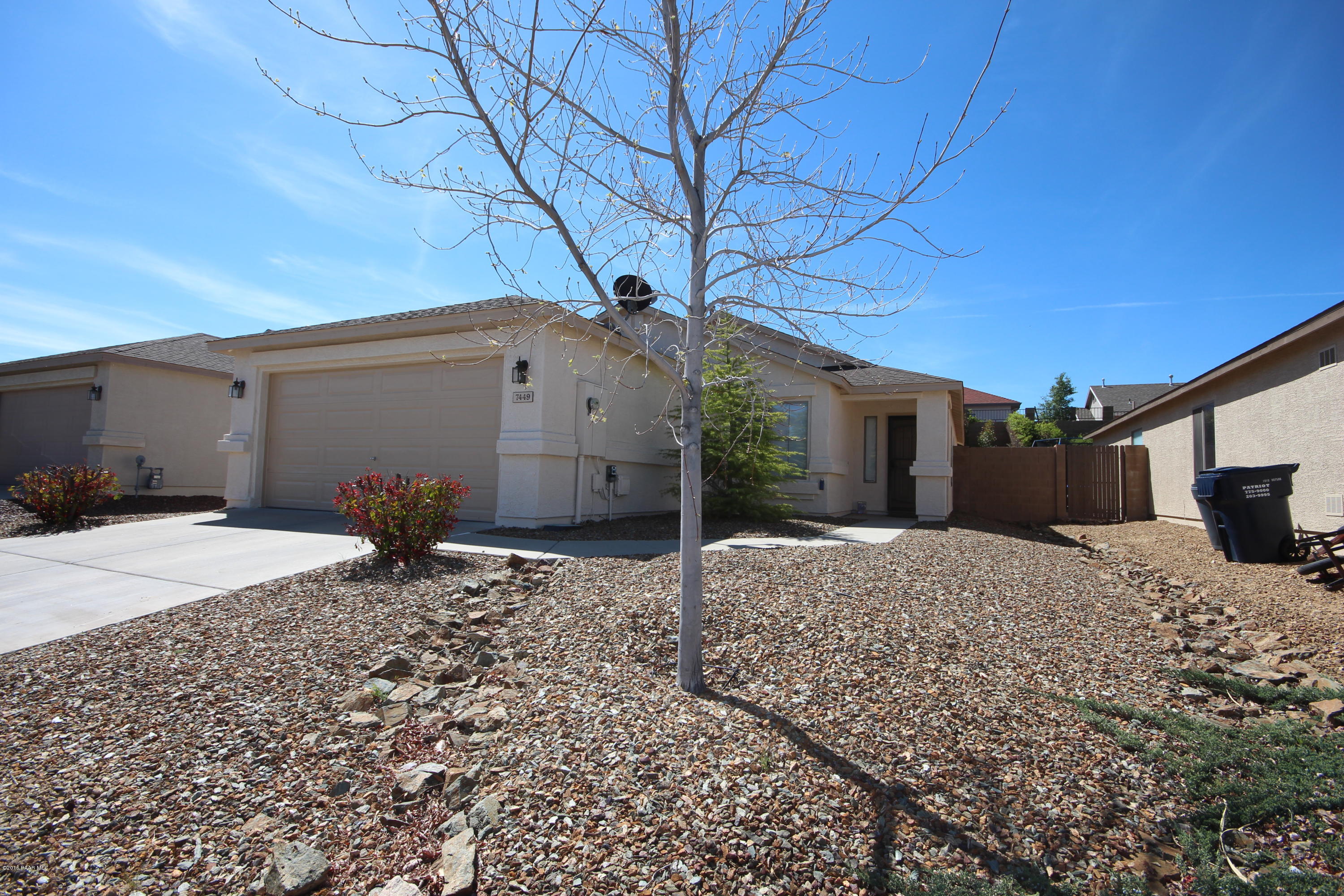 a house view with a backyard space