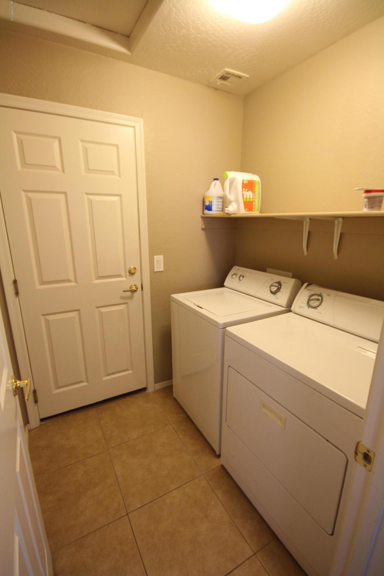 7449 East Plateau Ridge Road Prescott Valley, AZ 86315 - Photo 14 of 17 a utility room with dryer and washer